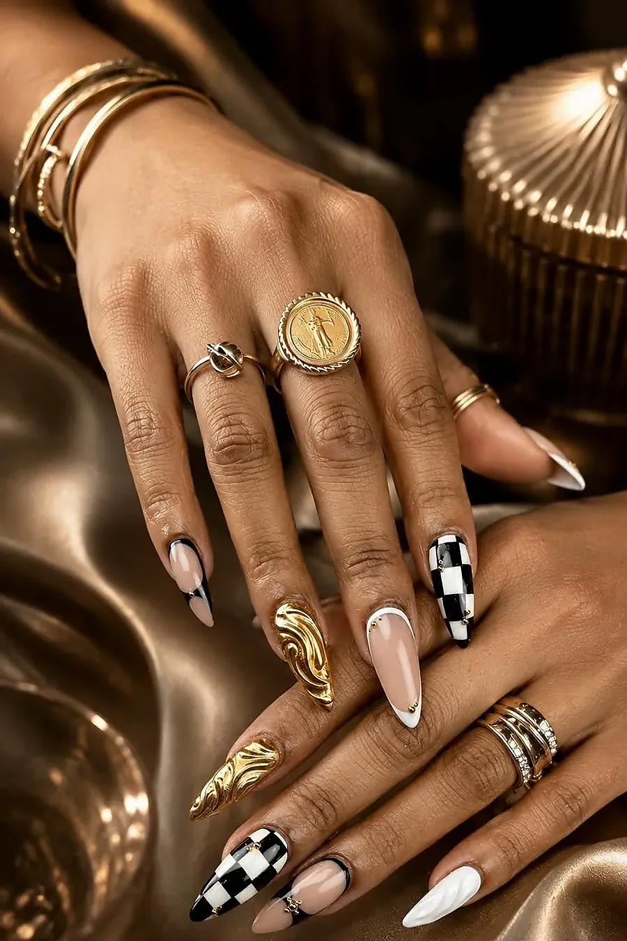 Chrome almond nail art with checkerboard and gold swirl design — luxury nails by Thuy Austin TX